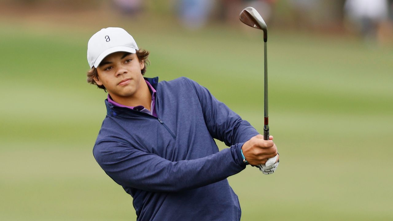 Charlie Woods takes a shot during a practice round before the PNC Championship