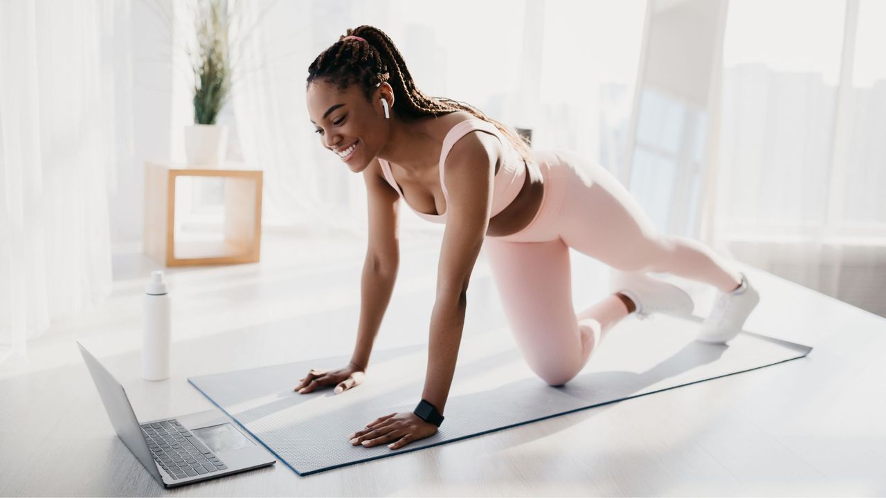 Pilates ab workout: A woman doing a workout at home