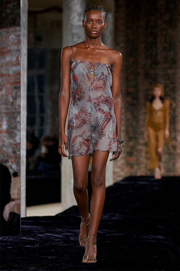 Punky leathers and checks were paired with feminine chiffon and delicate knit and crochet: buckled mini skirts
