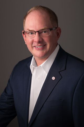 Smiling headshot of Jon Litt.