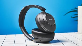 a pair of black headphones by earfun with cushiony ear cups and a black headband