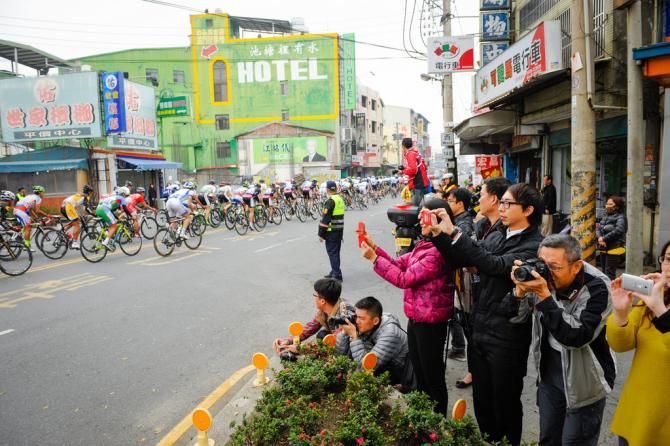Fans watching the race go by