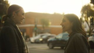 Olivia Buckle and Alexandra Swarens looking at each other in Looking for Her.