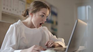 Apple patents: Woman at laptop looking very surprised