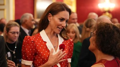 Catherine, Princess of Wales, speaks to guests during a Cancer Research UK reception to mark the charity's 125th anniversary at St James's Palace on June 2, 2026