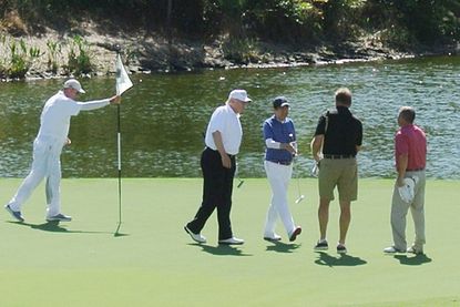 Trump golfs at one of his clubs in Florida