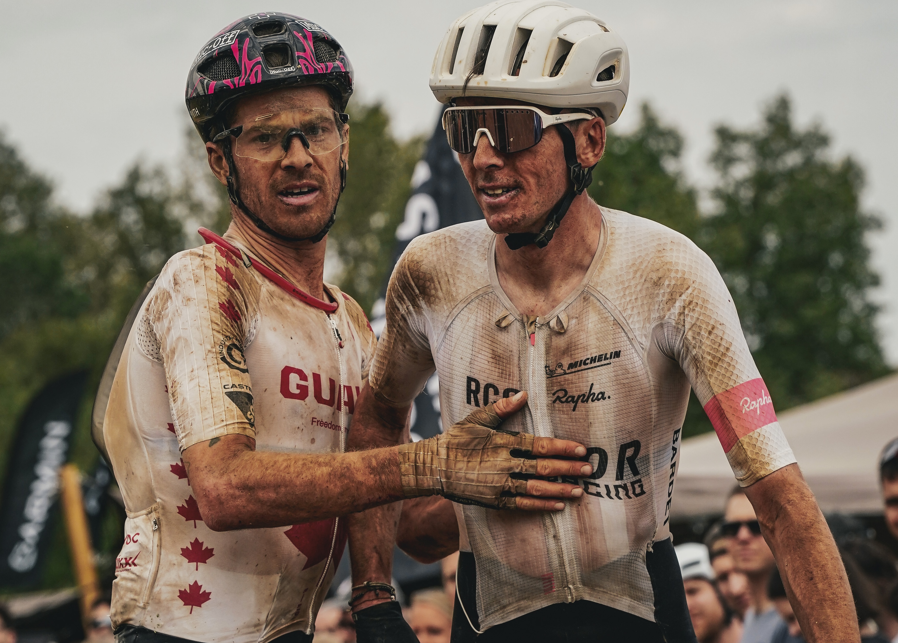 Romain Bardet of Factor Bikes - RCC (right) congratulates fellow racer Benjamin Perry at the finish of 2026 The Traka 360, Bardet fifth and Perry fourth