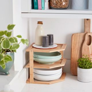 kitchen counter with wooden rack and bowls