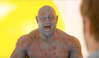 Drax laughing without any shame.