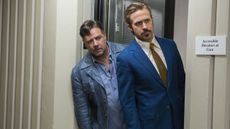 Jackson and Holland peer around a door frame in The Nice Guys
