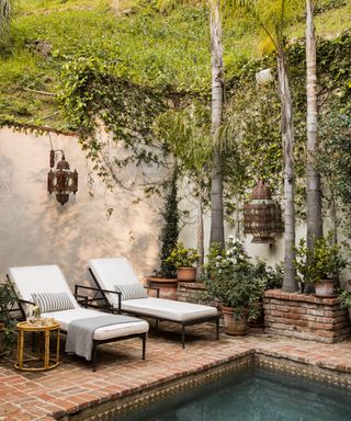 Sunloungers and pool in Spanish Colonial