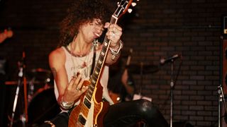 Slash performs live with the Hunter Burst Gibson Les Paul