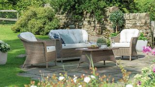 best outdoor furniture traditional wicker sofa chairs and coffee table in an English country garden