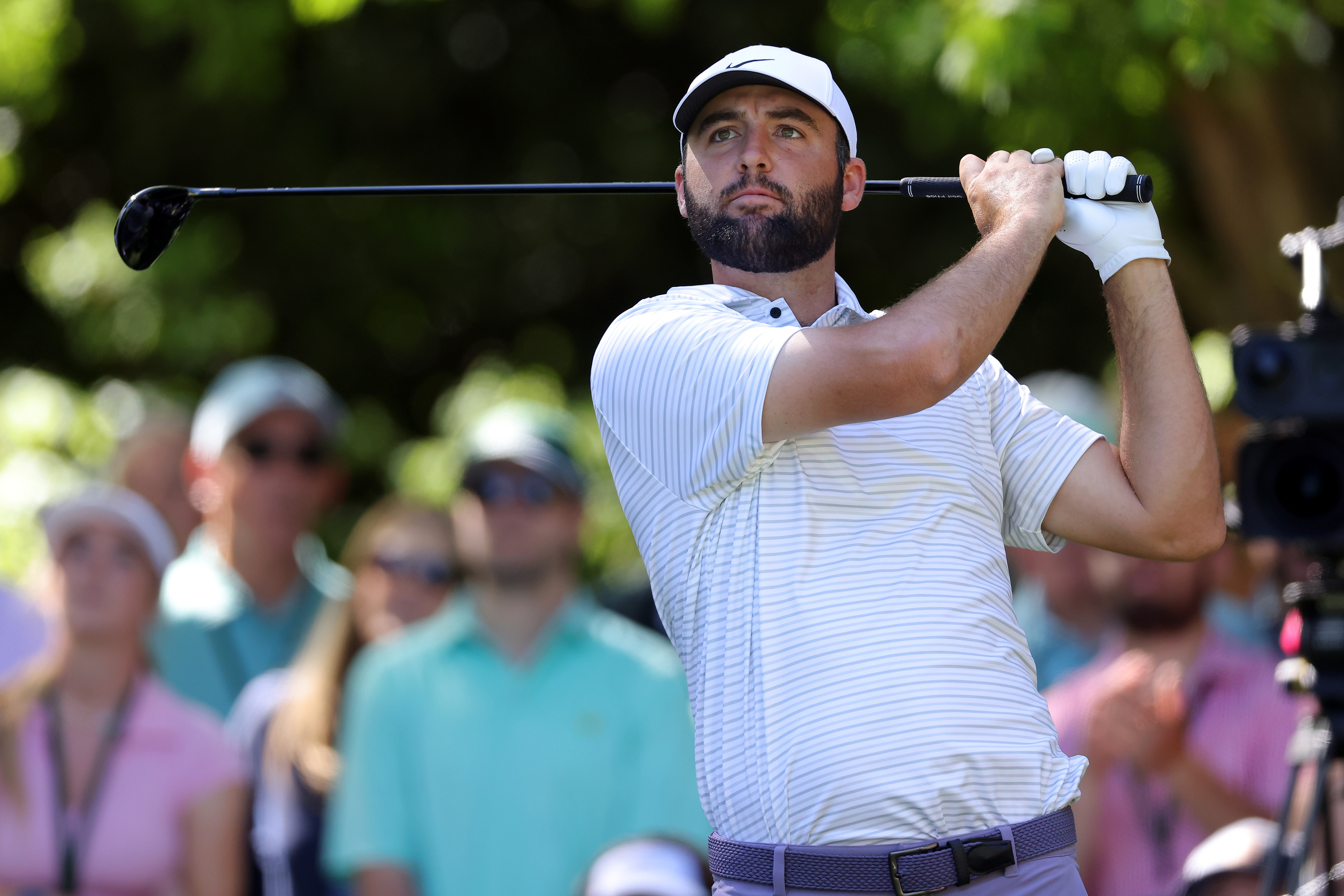 Scottie Scheffler plays his shot from the seventh tee during the third round of the 2024 Masters Tournament at Augusta National Golf Club