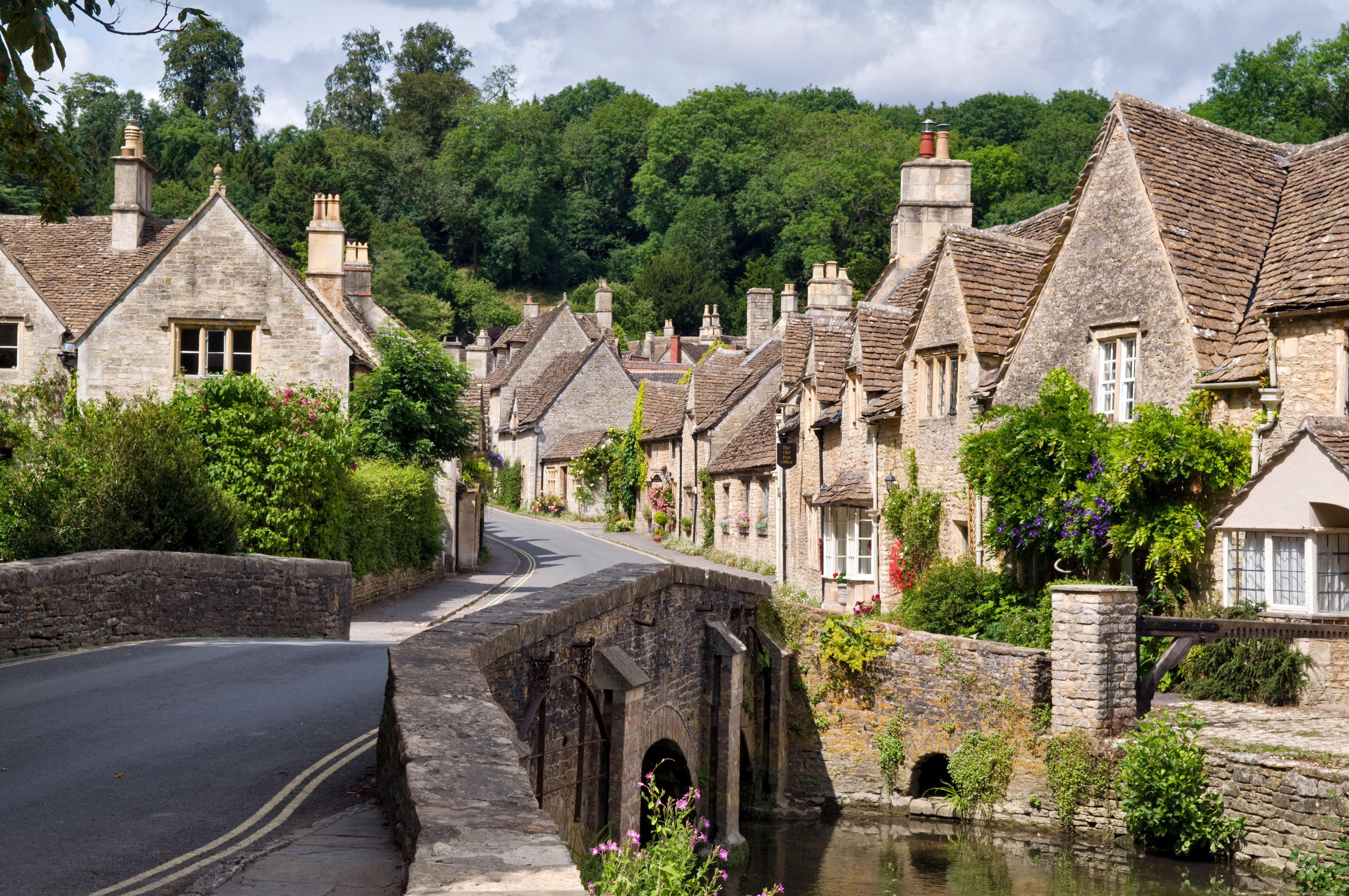 The picturesque village of Castle Combe in the Cotswolds, England in summer.
