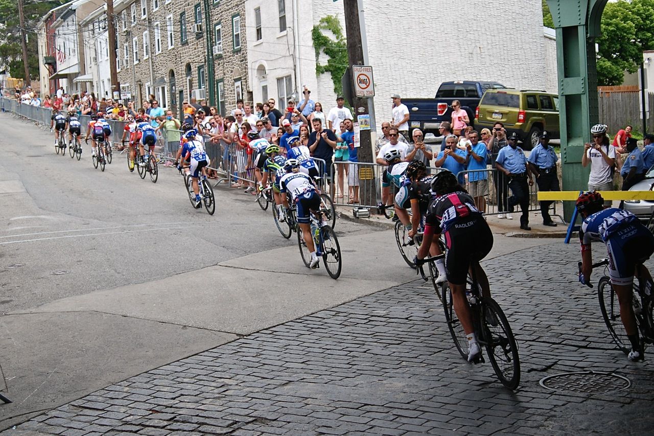 The peloton heads into the base of the Manayunk Wall