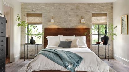 stylish modern bedroom with exposed brick wall from Fixer Upper: Welcome Home