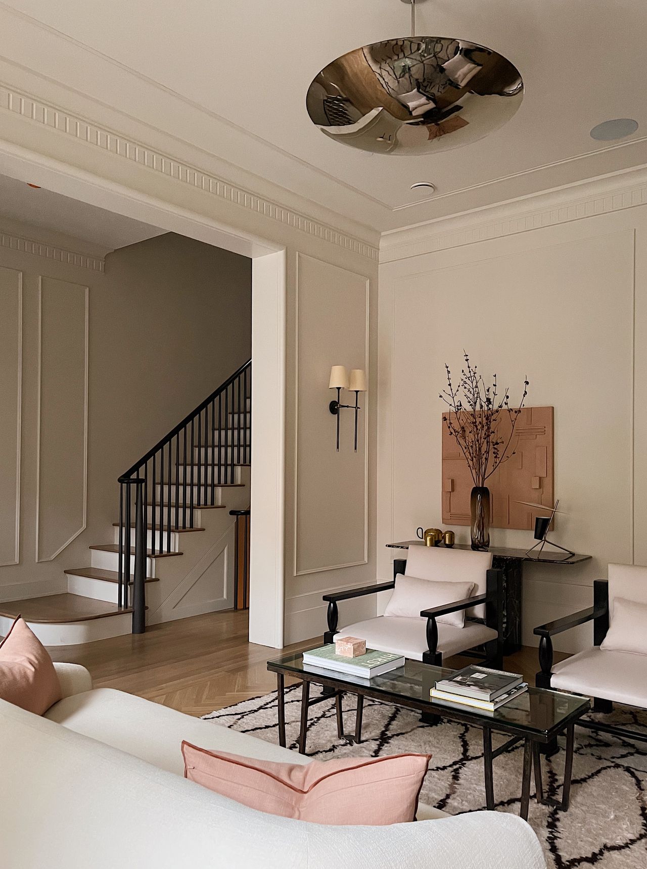 A living room with a ceiling light made in steel
