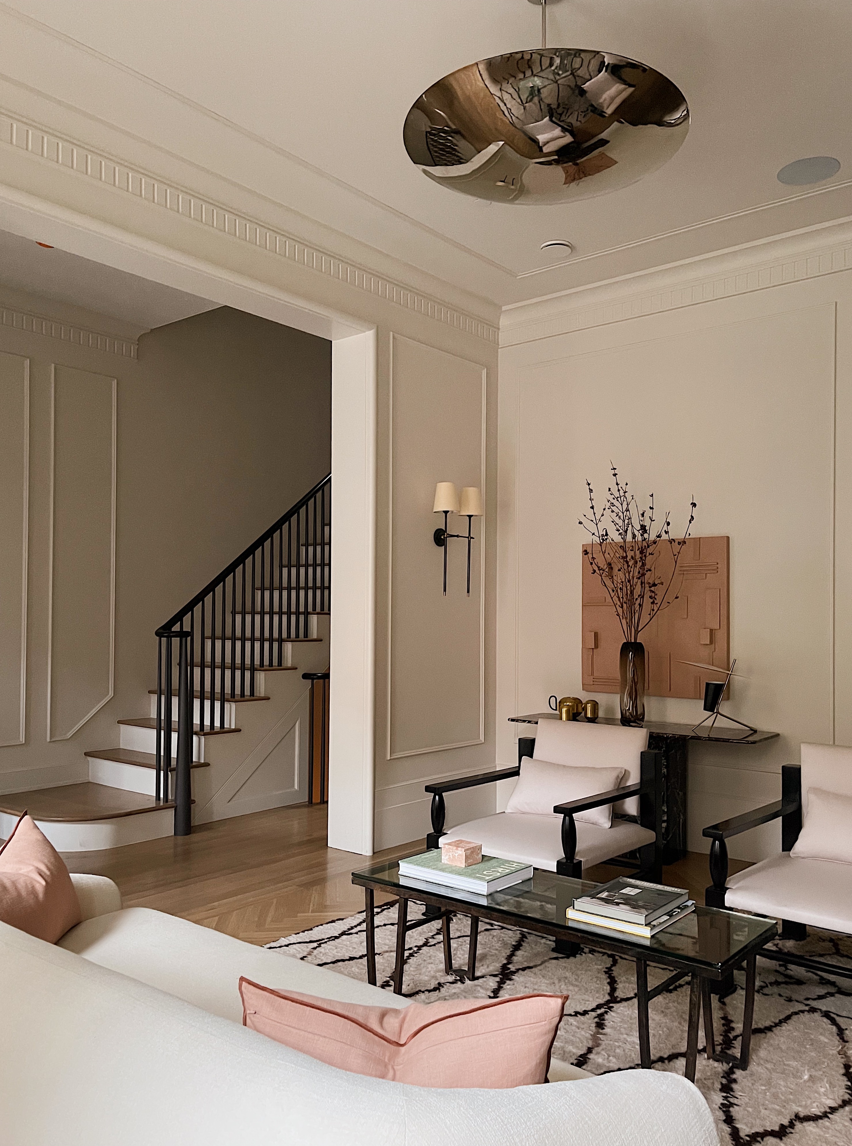 A living room with a ceiling light made in steel