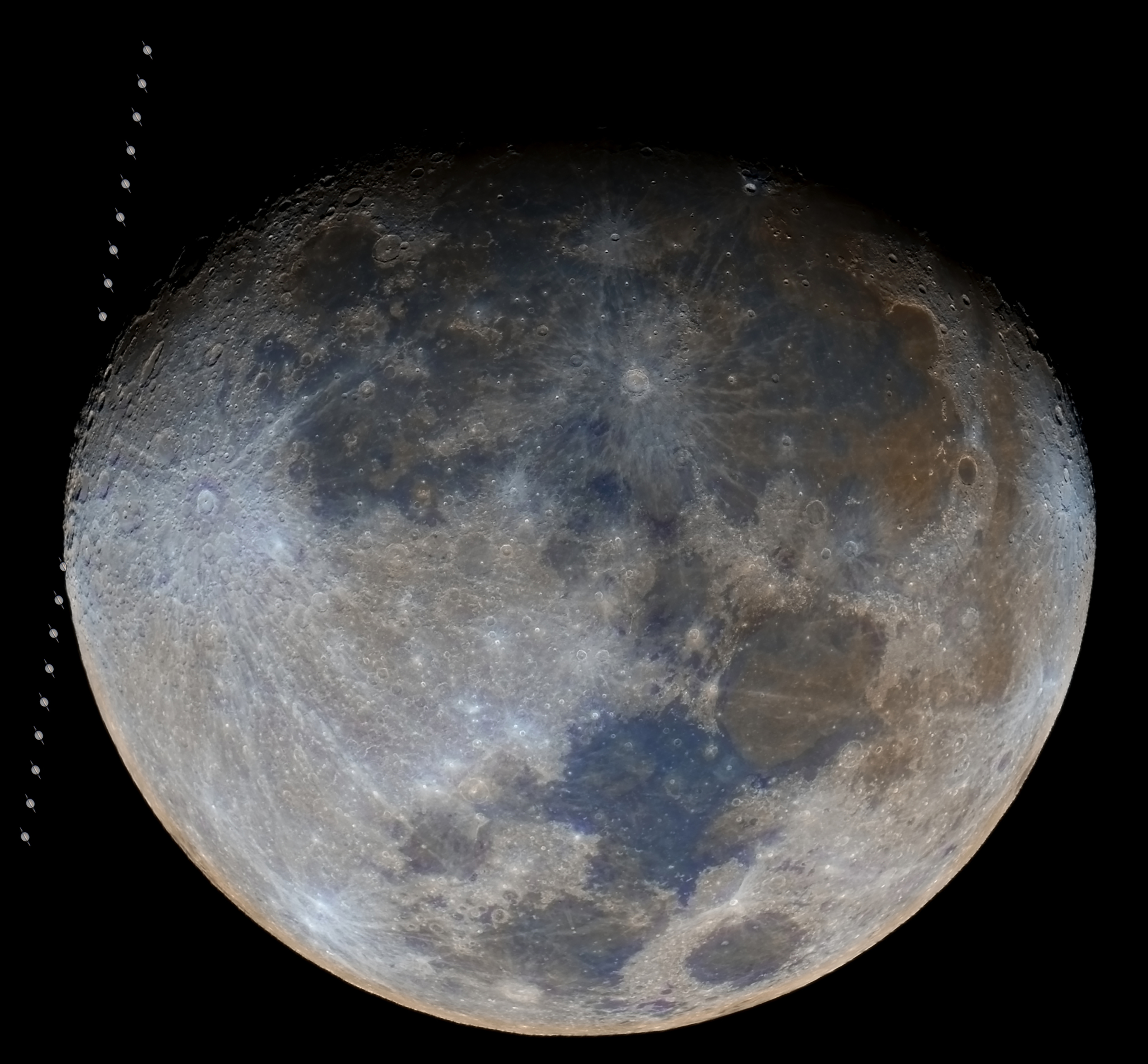 A close up of the full moon in the darkness of space