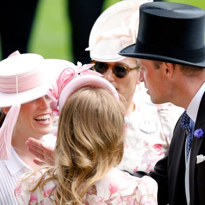 Prince William playing with Princess Eugenie's hat