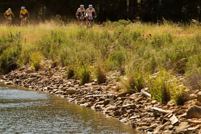 Nino Schurter and Florian Vogel of team Scott-SwissPower ahead of overall winners Christoph Sauser and Jaroslav Kulhavy of Team Burry Stander-Songo