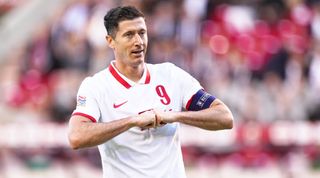 Robert Lewandowski of Poland celebrates after scoring his team's 1st goal during the UEFA Nations League League A Group 4 match between Belgium and Poland on June 8, 2022 in Brussels, Belgium.