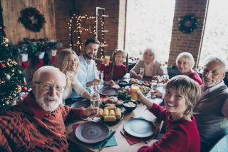rule of six at Christmas: family having Christmas dinner