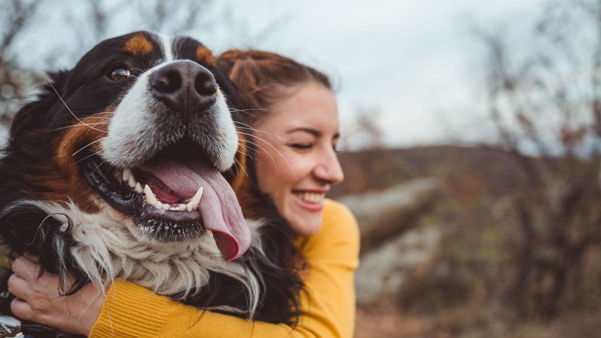 Woman hugging dog