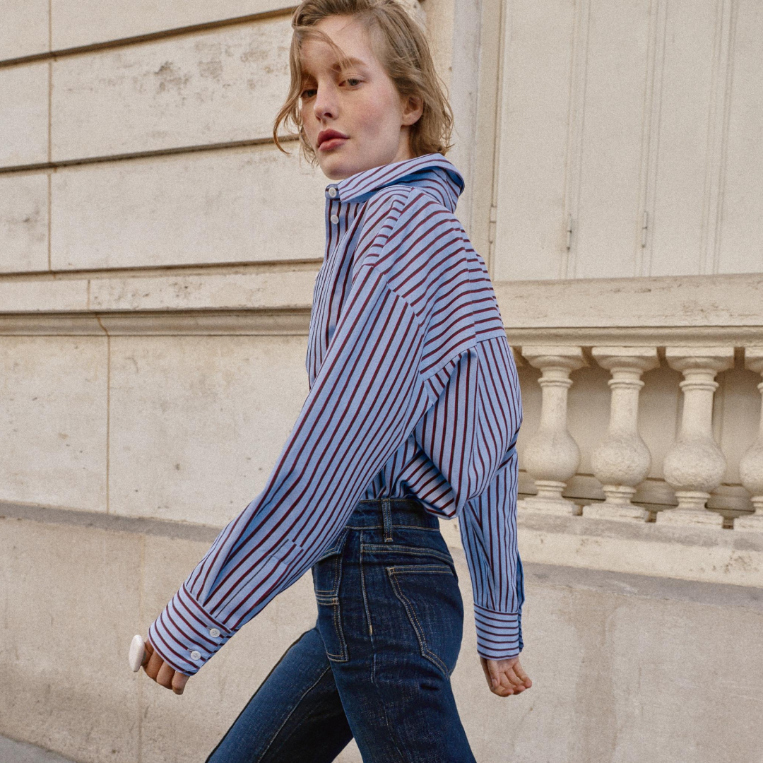 Zara model wearing striped button down shirt and jeans 