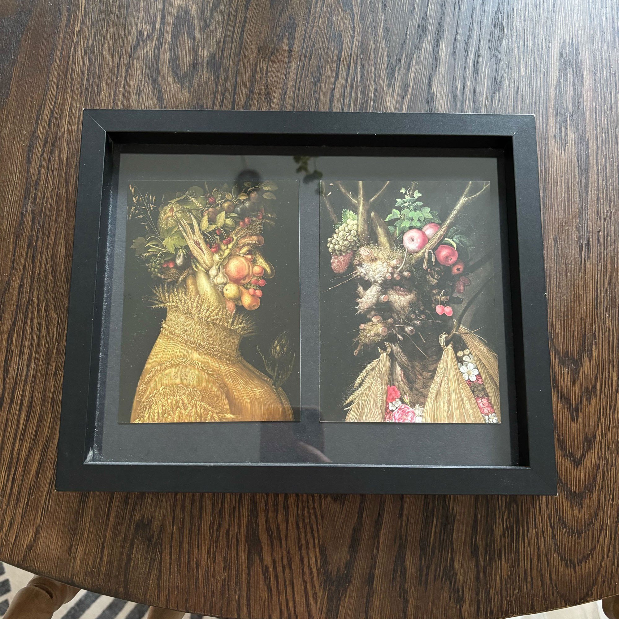 Black frame with two fruit and veg men postcards