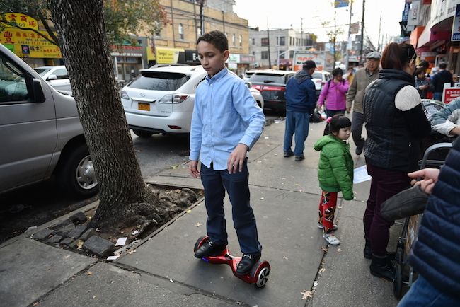 A child rides a self-balancing scooter.