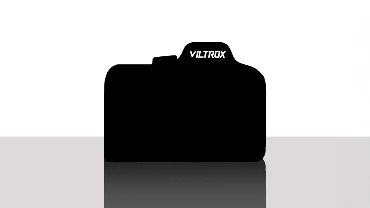 A silhouette of a camera with a Viltrox logo on top, set against a white background, reflecting on a smooth surface