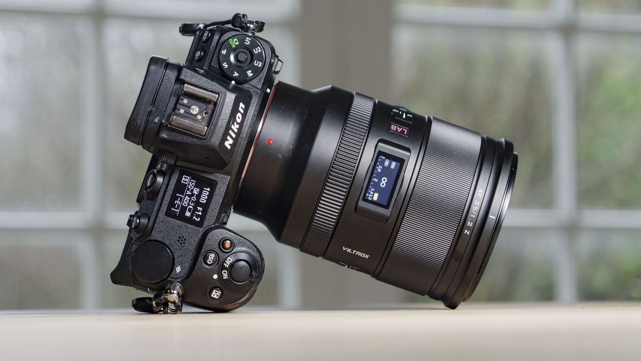 Viltrox AF 35mm F1.2 LAB Z lens for Nikon, attached to a Nikon Z6 II, on a wooden table