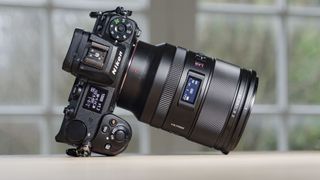 Viltrox AF 35mm F1.2 LAB Z lens for Nikon, attached to a Nikon Z6 II, on a wooden table