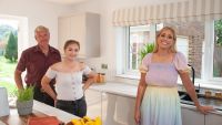 Stacey Solomon with father and daughter in their newly renovated kitchen