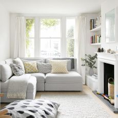 living room with white wall and white sofa 
