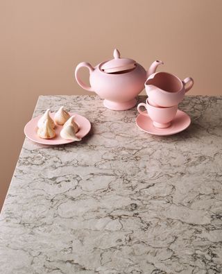 Pink tableware on marble-inspired tabletop