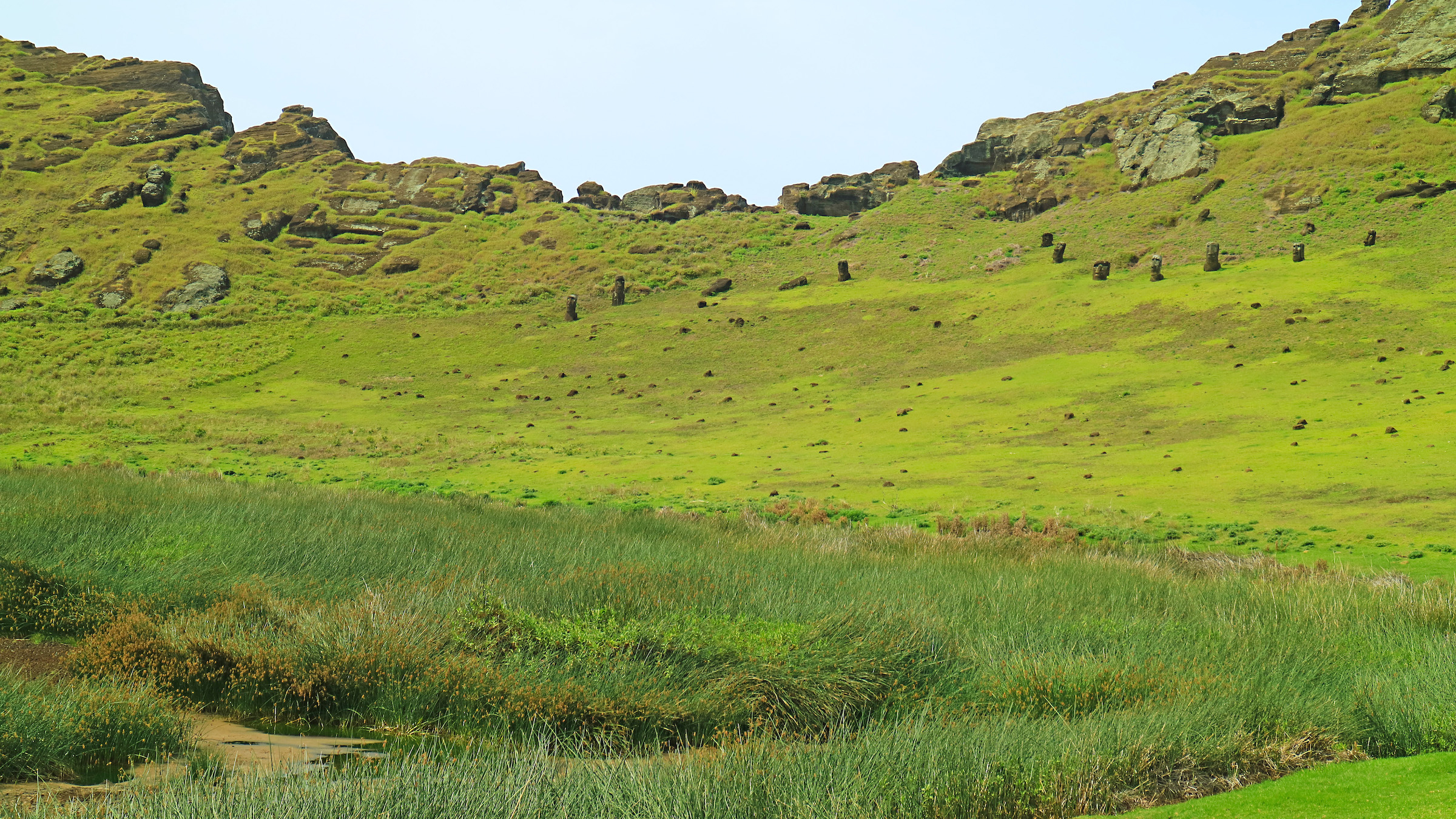 Other moai statues sit on the slopes of Lake Rano Raraku's crater lake.