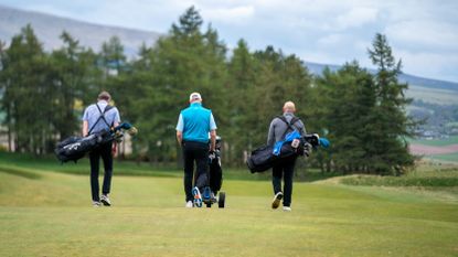 Three golfers on the course at Gleneagles