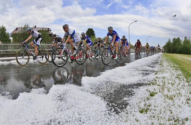 The peloton slowed to get through hail-covered roads safely