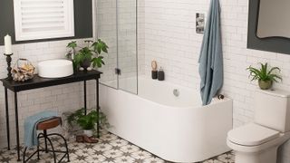 white bathroom with shower over bath and star floor tiles