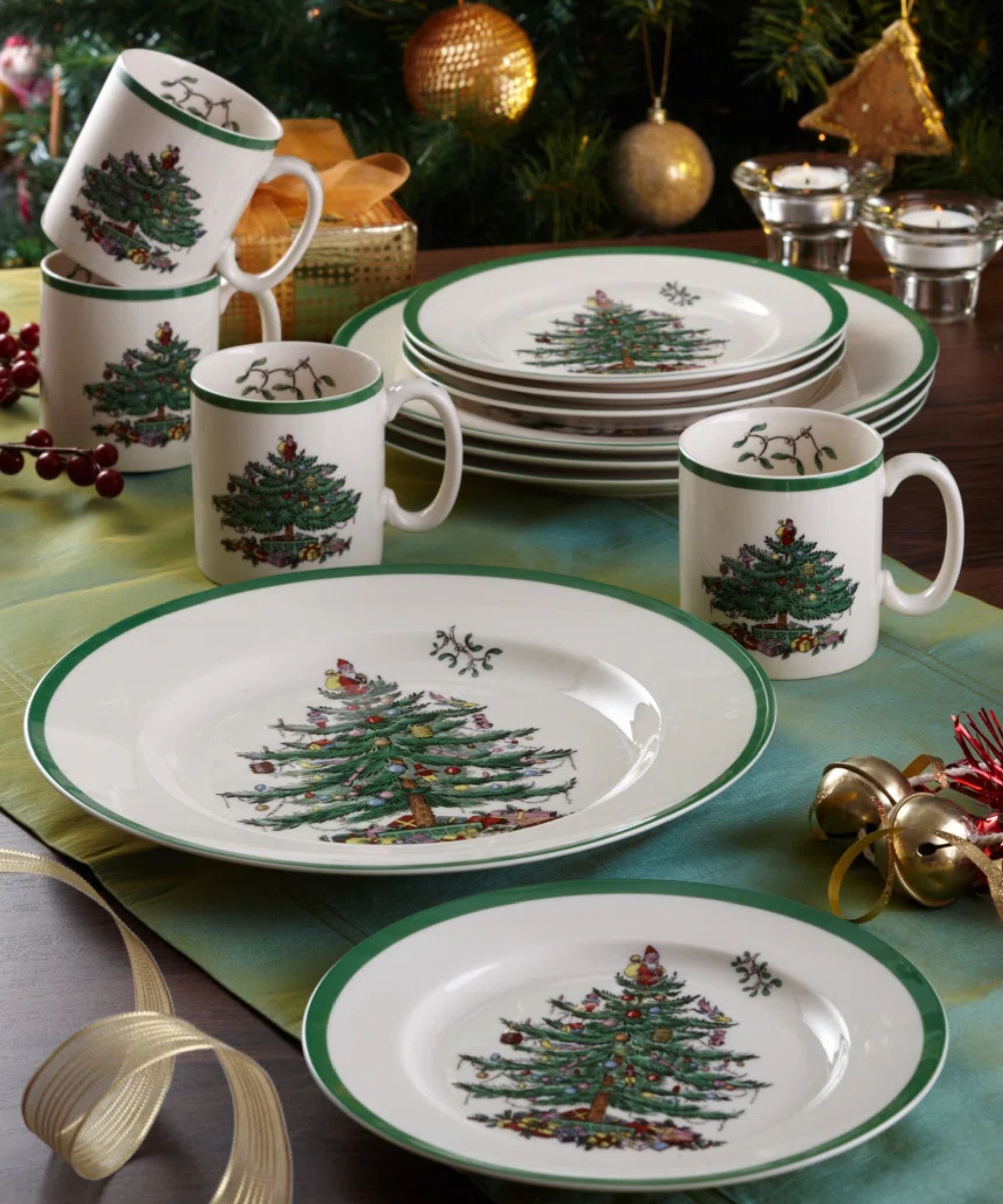 Green Christmas table with gold baubles and Christmas tree crockery