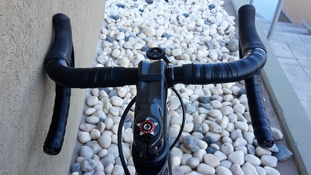 Boonen is running "officially" using a custom Specialized stem with the FSA Compact 40 bar