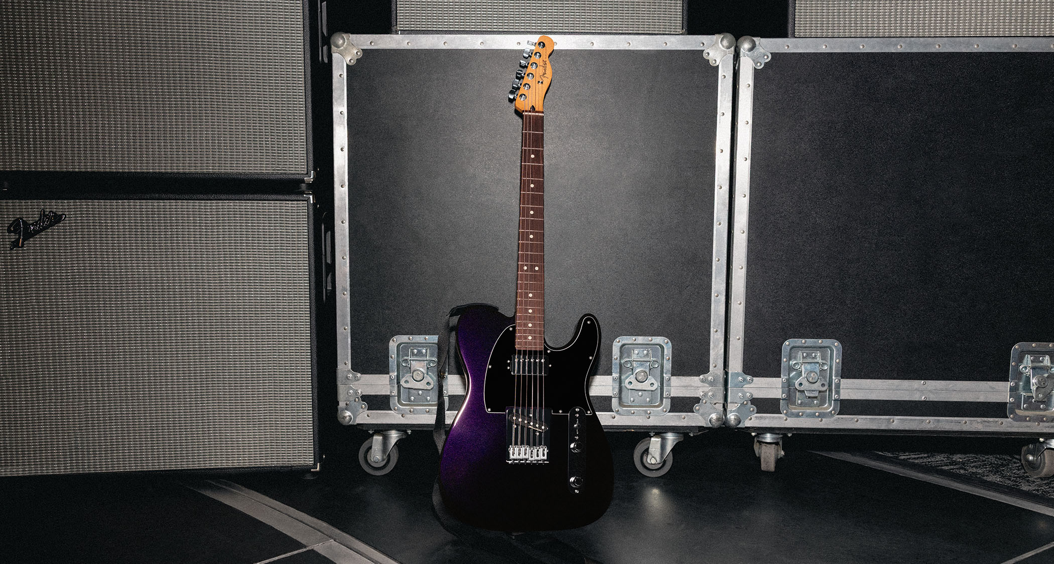 Fender Player II Modified Telecaster SH: the factory-modded, humbucker-equipped Telecaster is finished in Dusk, a dark metallic purple, and is photographed backstage.