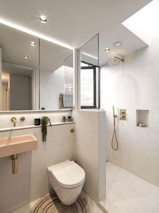 a bathroom with a window in the shower enclosure