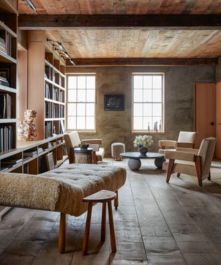 Library with bookshelves and fleece chaise longue in 19th century four storey West Village townhouse