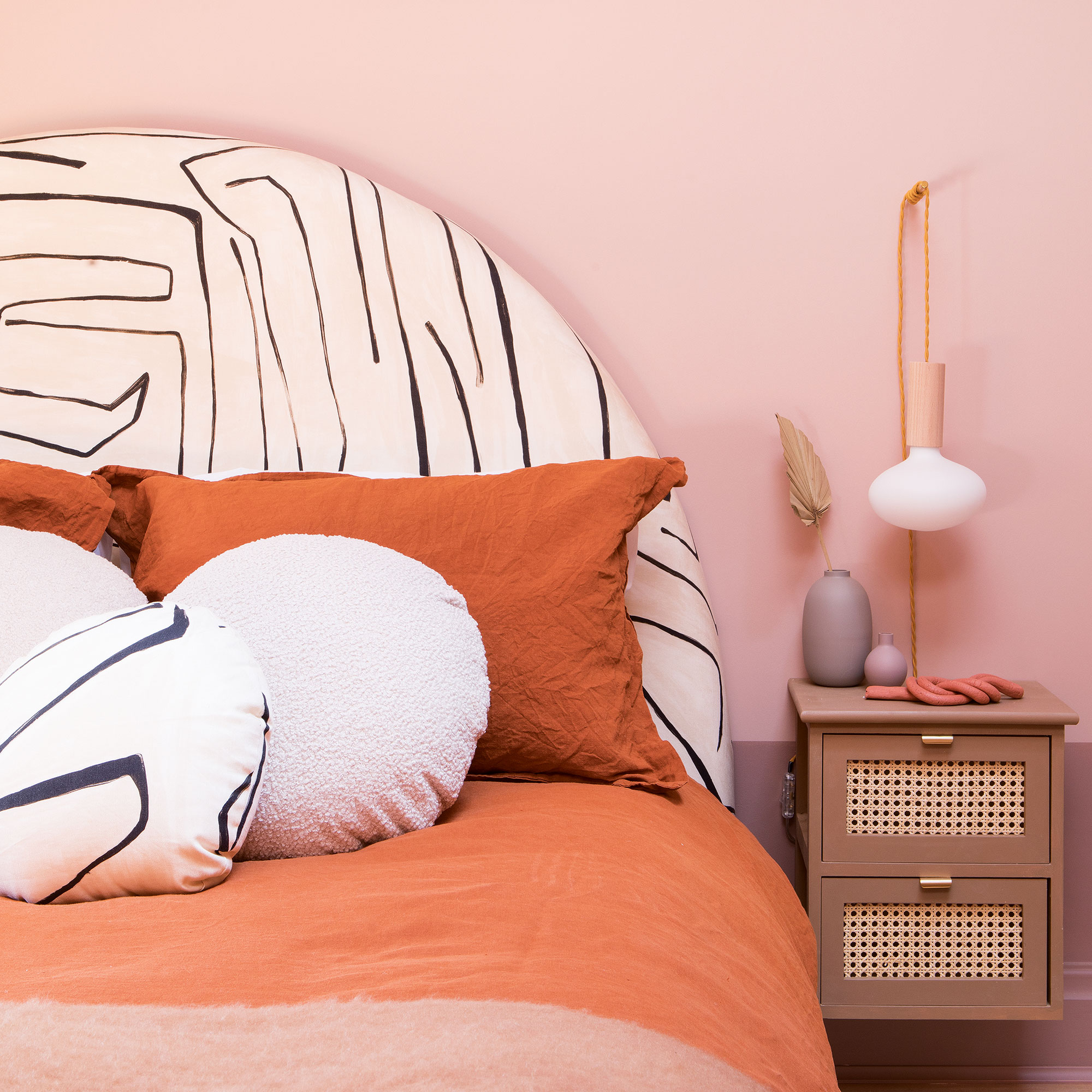 bedroom with side table and table lamp