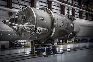 Close-up view of one of SpaceX’s three landed Falcon 9 first stages. Photo taken inside a hangar at Kennedy Space Center’s Launch Complex 39A on May 14, 2016.