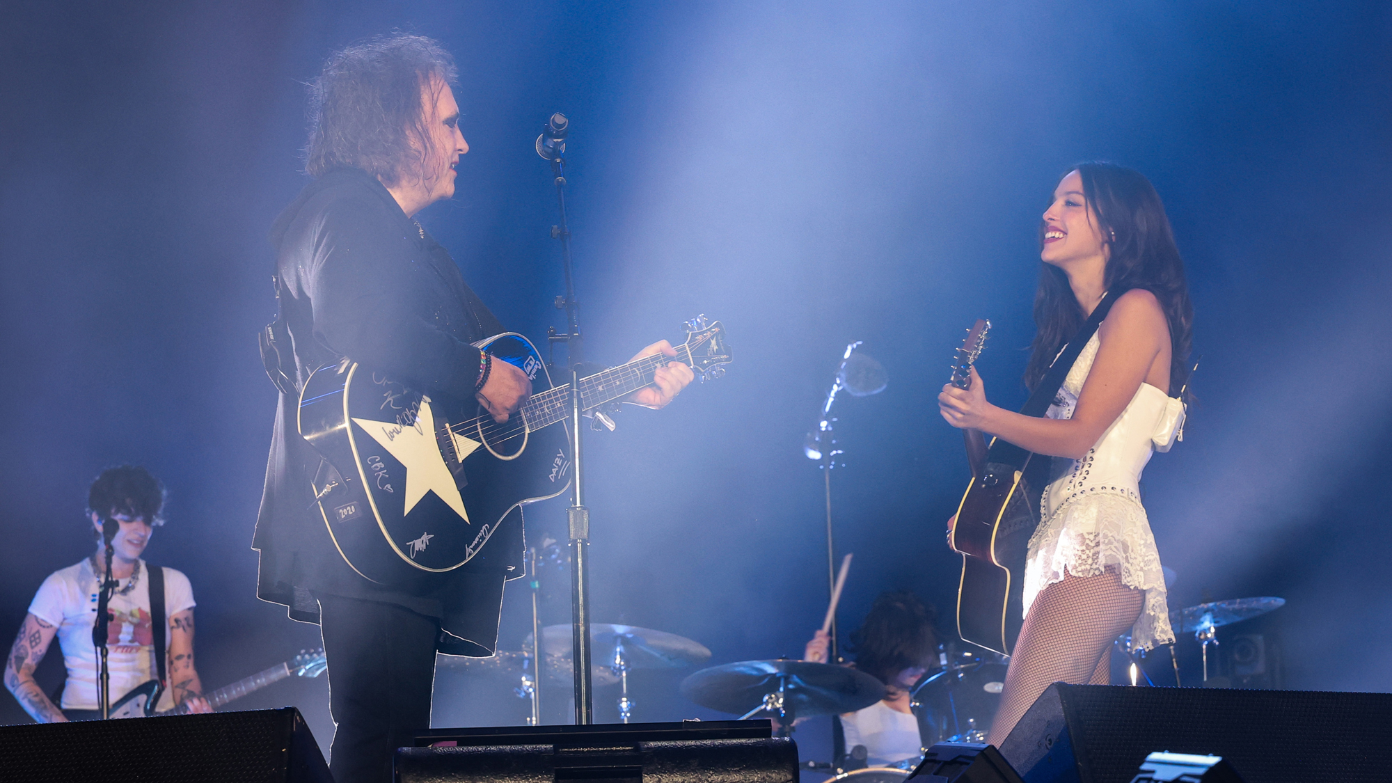 Olivia Rodrigo performs with Robert Smith (R) onstage during day five of the Glastonbury Festival 2025 at Worthy Farm, Pilton on June 29, 2025 in Glastonbury, England.